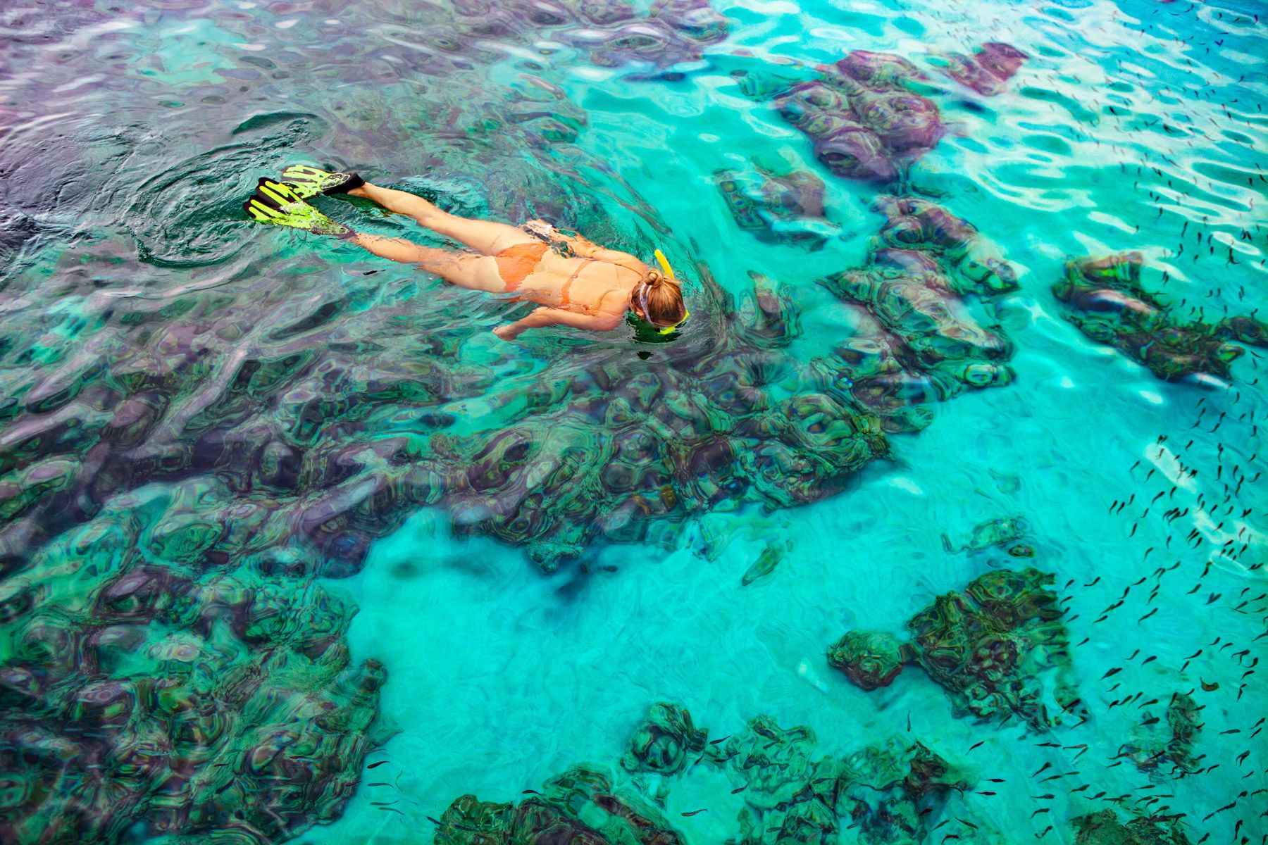 young girl snorkel crystal water