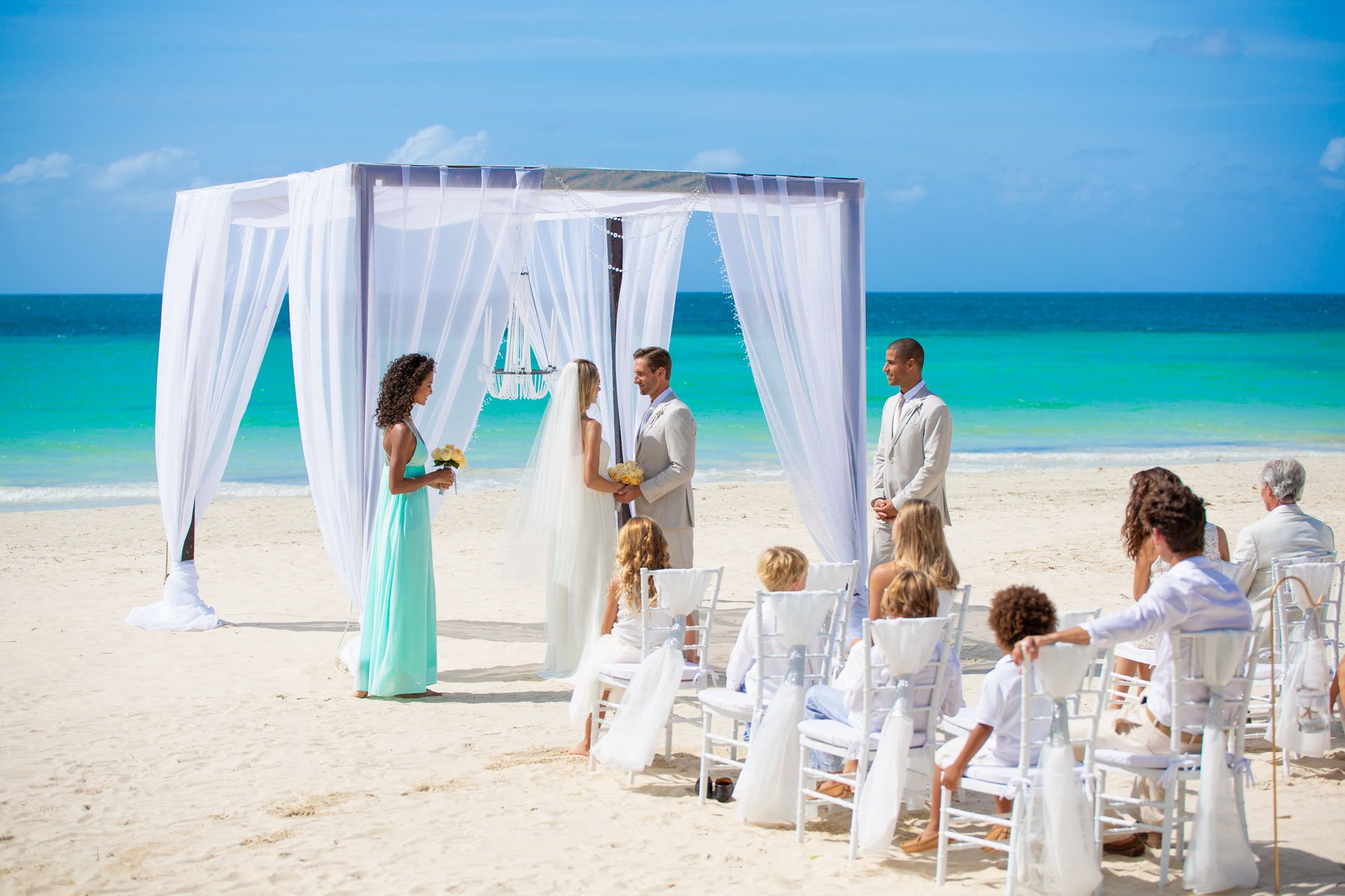 wedding on beach with guests